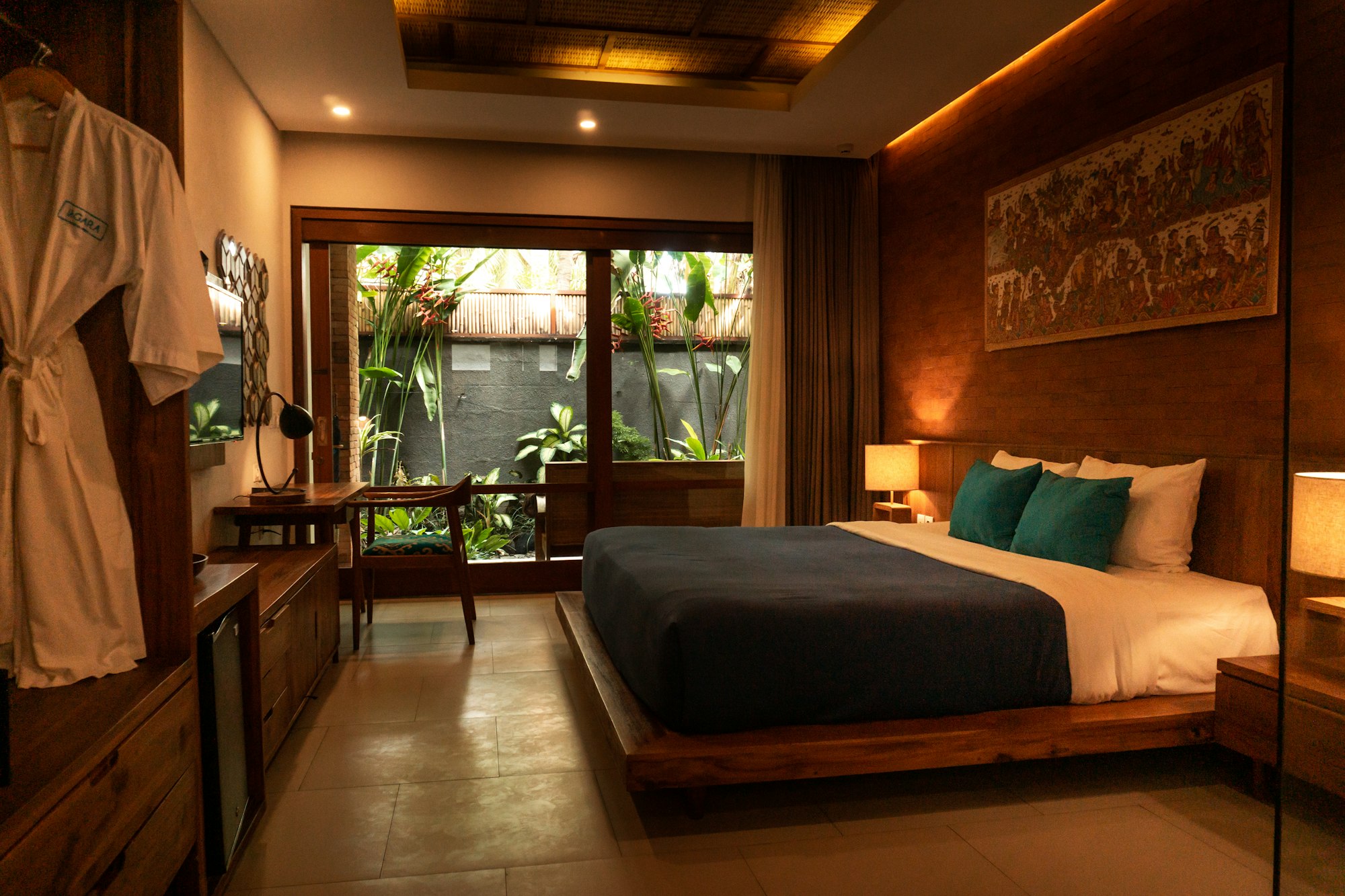 Warm morning light across a cedar-beamed bedroom at Colombohaven.